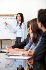 stock-photo-woman-at-the-office-making-a-business-presentation-47015479