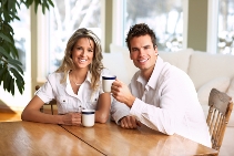 stock-photo-young-love-couple-taking-breakfast-in-the-comfortable-apartment-9973540